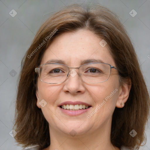 Joyful white adult female with medium  brown hair and grey eyes