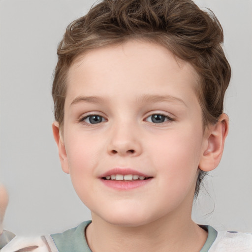 Joyful white child female with short  brown hair and brown eyes