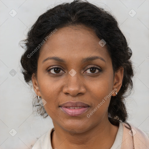 Joyful black adult female with medium  brown hair and brown eyes