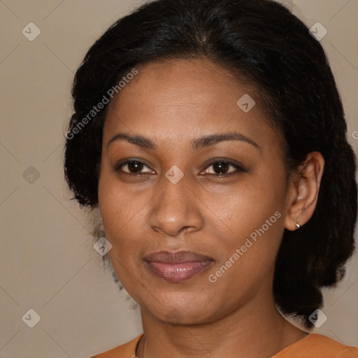 Joyful latino adult female with medium  brown hair and brown eyes
