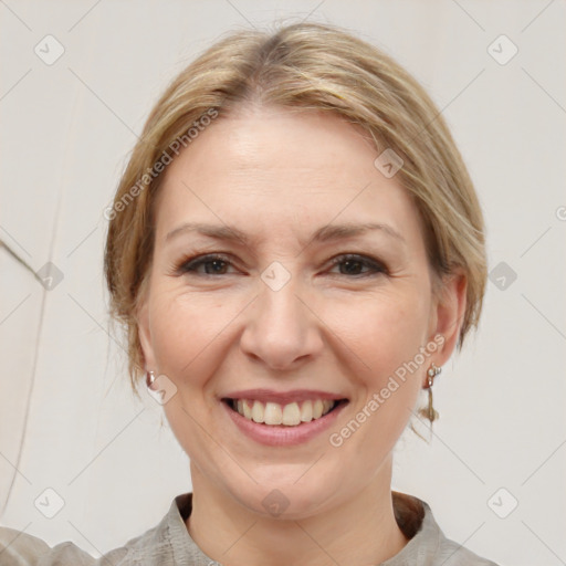 Joyful white adult female with medium  brown hair and grey eyes