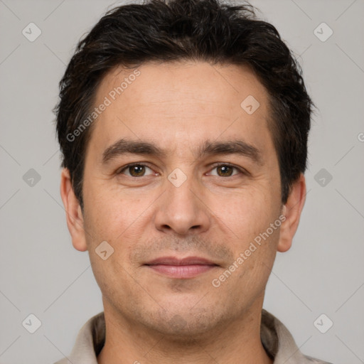 Joyful white adult male with short  brown hair and brown eyes