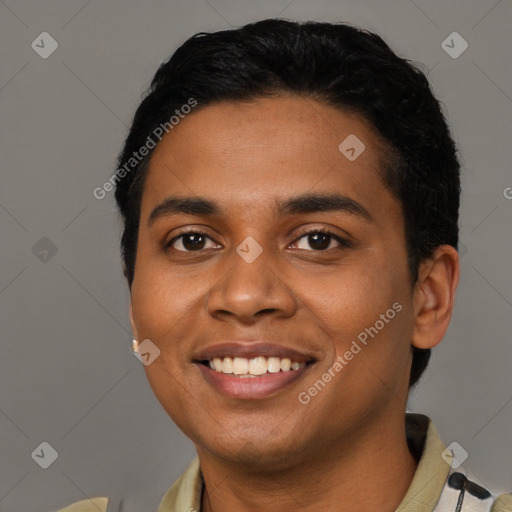 Joyful latino young-adult male with short  black hair and brown eyes