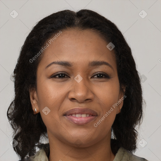 Joyful black young-adult female with long  brown hair and brown eyes