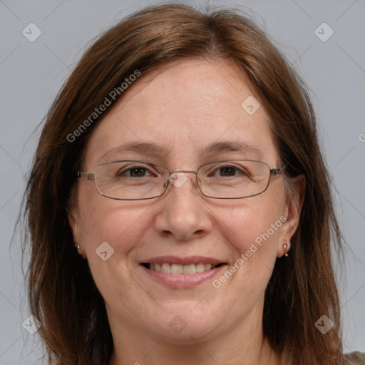 Joyful white adult female with long  brown hair and brown eyes