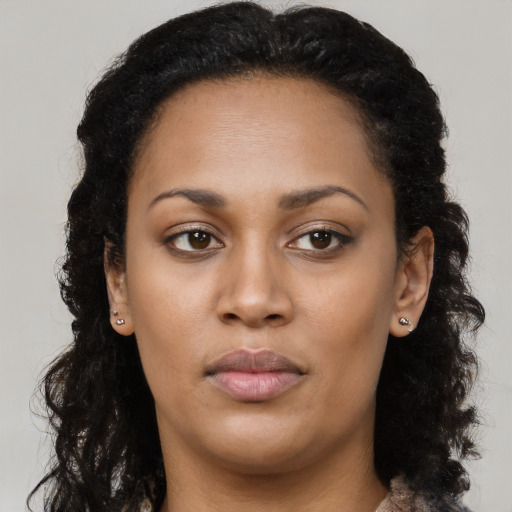 Neutral black young-adult female with long  brown hair and brown eyes