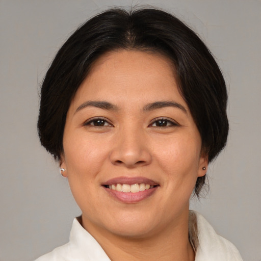 Joyful white young-adult female with medium  brown hair and brown eyes