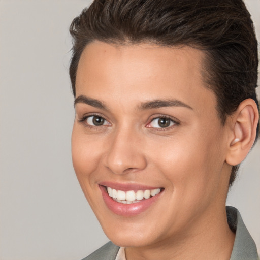 Joyful white young-adult female with short  brown hair and brown eyes