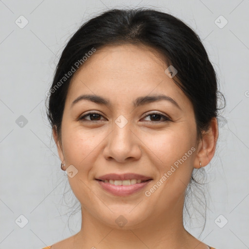 Joyful latino young-adult female with medium  brown hair and brown eyes