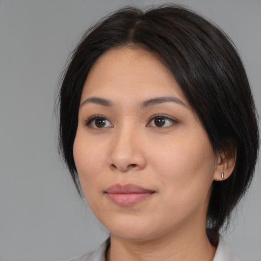 Neutral latino young-adult female with medium  black hair and brown eyes