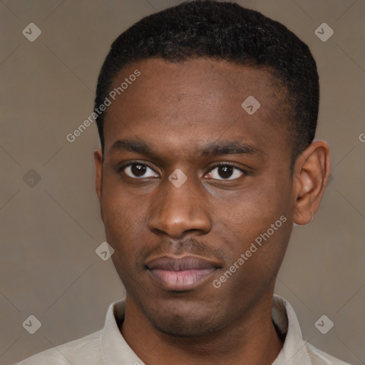 Joyful black young-adult male with short  brown hair and brown eyes