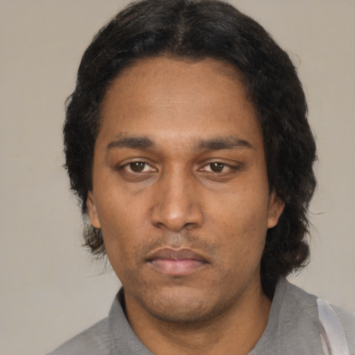 Neutral black adult male with short  black hair and brown eyes