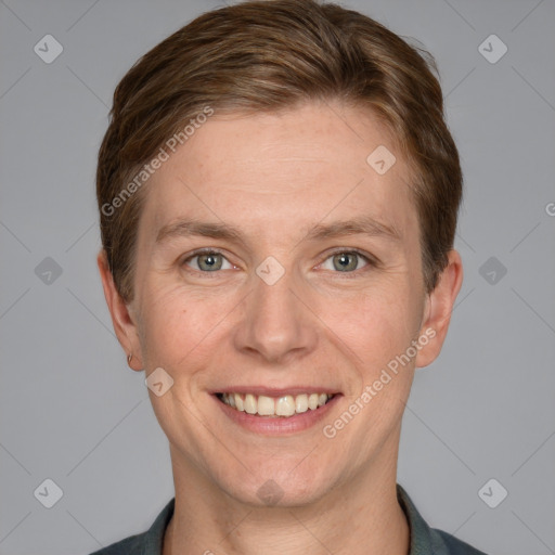 Joyful white adult female with short  brown hair and grey eyes