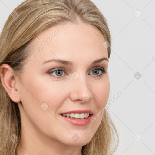 Joyful white young-adult female with long  brown hair and blue eyes