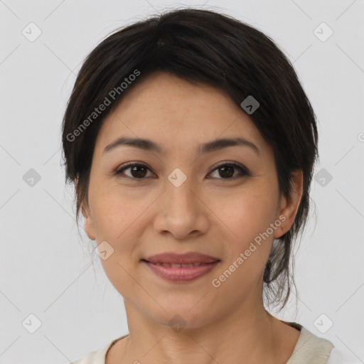 Joyful asian young-adult female with short  brown hair and brown eyes