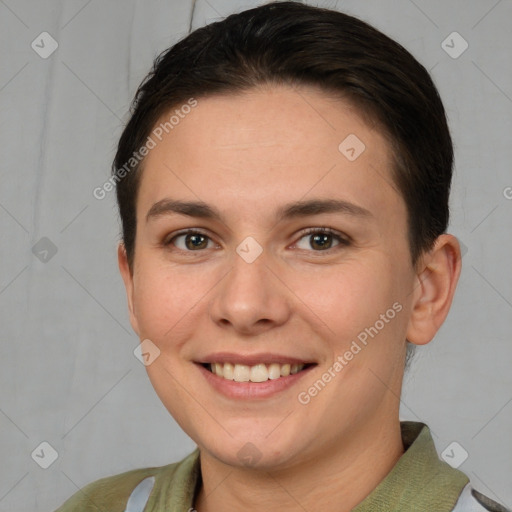 Joyful white young-adult female with short  brown hair and brown eyes