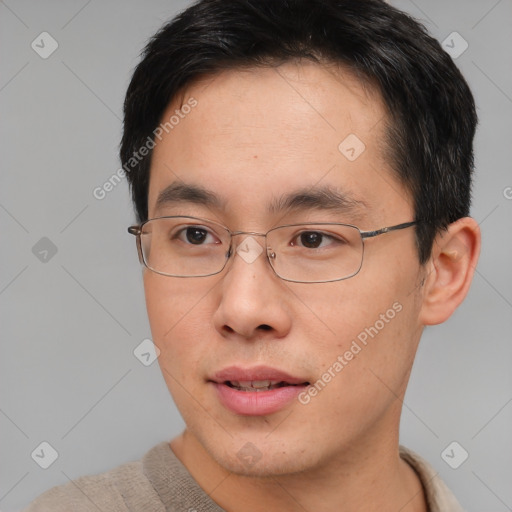 Neutral asian young-adult male with short  brown hair and brown eyes