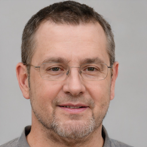 Joyful white adult male with short  brown hair and grey eyes