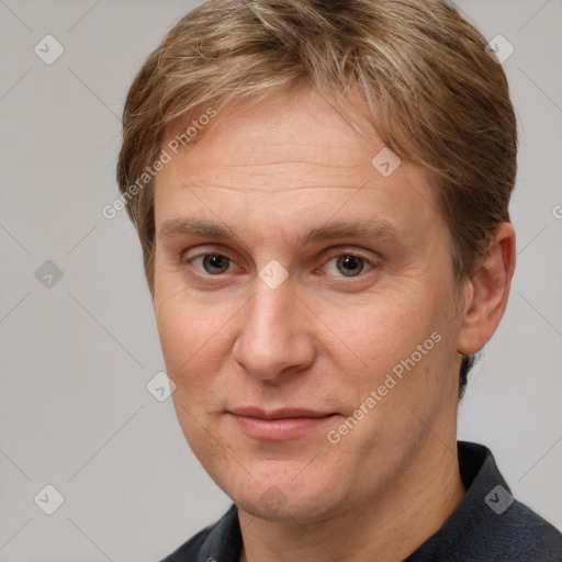 Joyful white adult male with short  brown hair and grey eyes