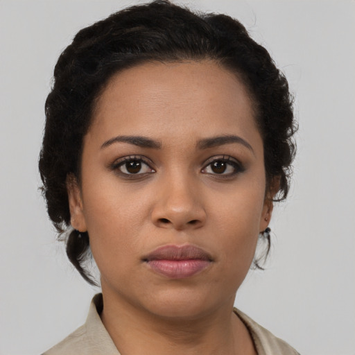 Neutral black young-adult female with short  brown hair and brown eyes