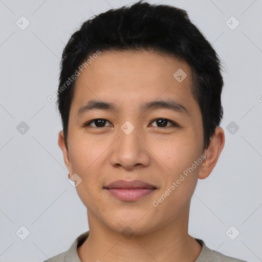 Joyful asian young-adult male with short  black hair and brown eyes