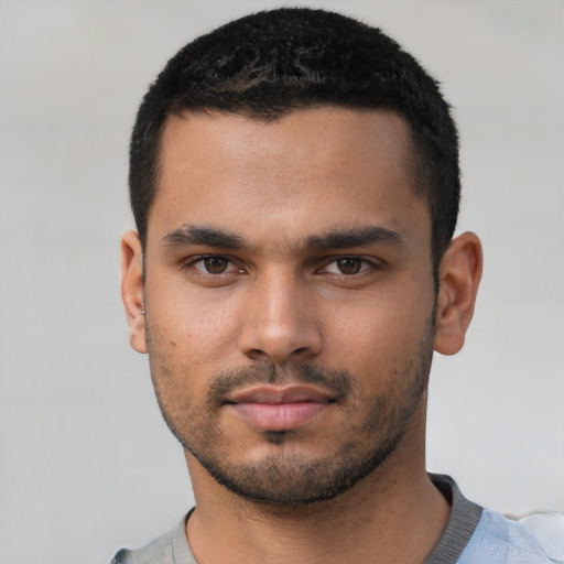 Neutral latino young-adult male with short  black hair and brown eyes