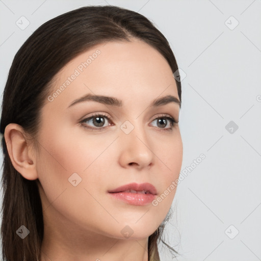 Neutral white young-adult female with long  brown hair and brown eyes