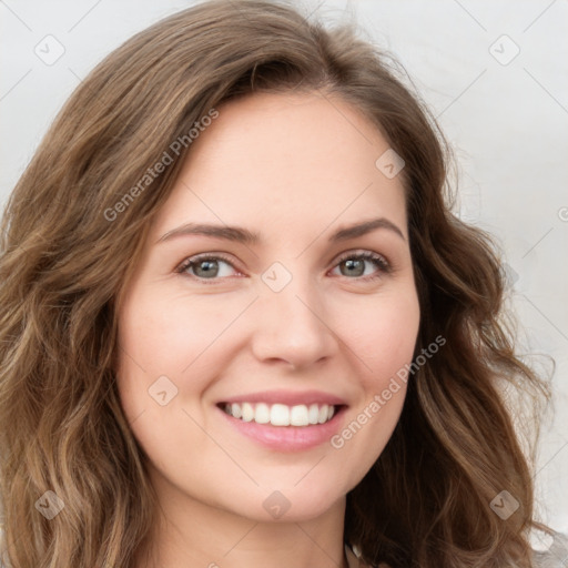 Joyful white young-adult female with long  brown hair and green eyes