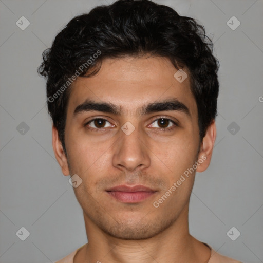 Joyful white young-adult male with short  black hair and brown eyes