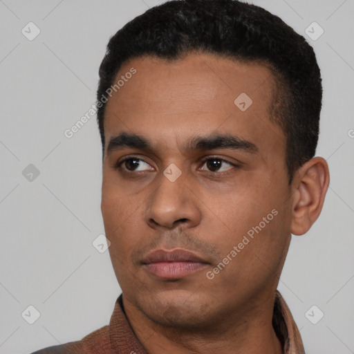 Neutral latino young-adult male with short  black hair and brown eyes