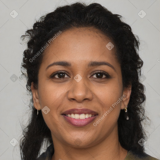 Joyful black young-adult female with long  brown hair and brown eyes