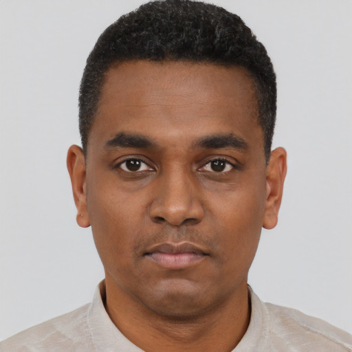 Neutral black young-adult male with short  black hair and brown eyes