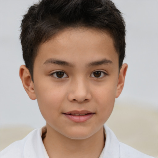 Joyful white child male with short  brown hair and brown eyes