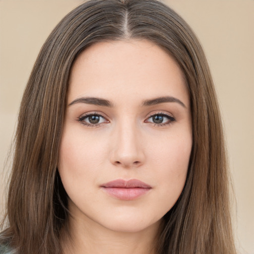 Neutral white young-adult female with long  brown hair and brown eyes