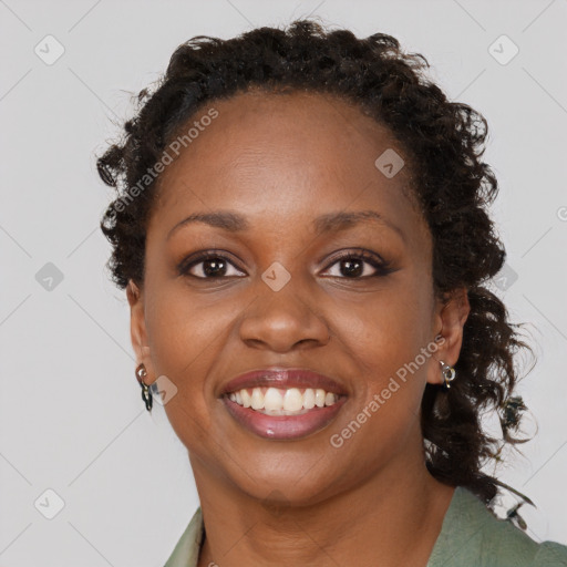 Joyful black young-adult female with medium  brown hair and brown eyes