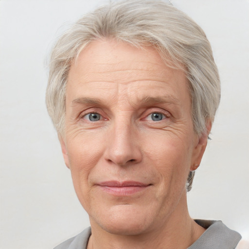 Joyful white middle-aged male with short  gray hair and grey eyes