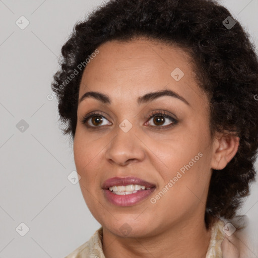 Joyful black young-adult female with medium  brown hair and brown eyes