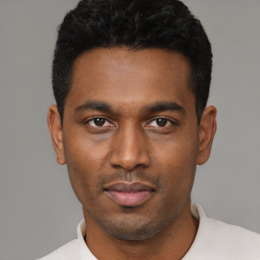 Neutral black young-adult male with short  black hair and brown eyes