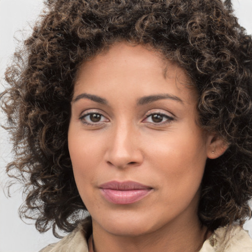 Joyful white young-adult female with medium  brown hair and brown eyes