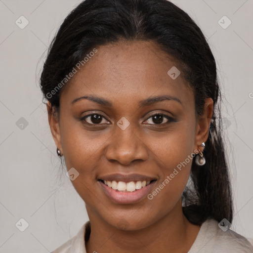 Joyful black young-adult female with medium  brown hair and brown eyes