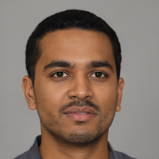 Neutral black young-adult male with short  brown hair and brown eyes