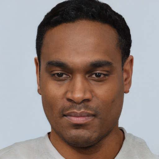 Neutral black young-adult male with short  black hair and brown eyes