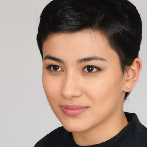 Joyful asian young-adult female with short  black hair and brown eyes