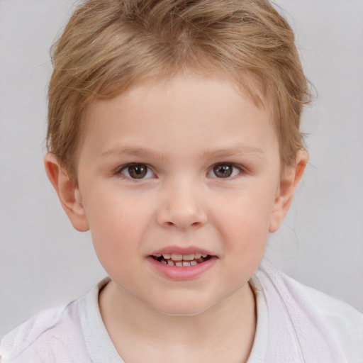 Joyful white child male with short  brown hair and brown eyes