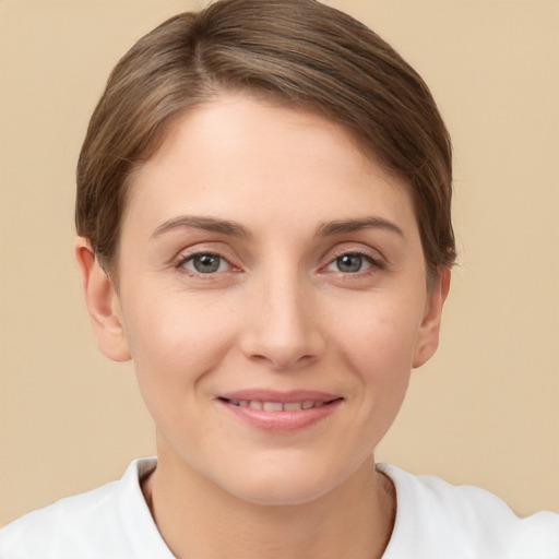 Joyful white young-adult female with short  brown hair and brown eyes