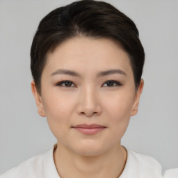 Joyful asian young-adult female with short  brown hair and brown eyes