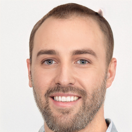 Joyful white young-adult male with short  brown hair and brown eyes