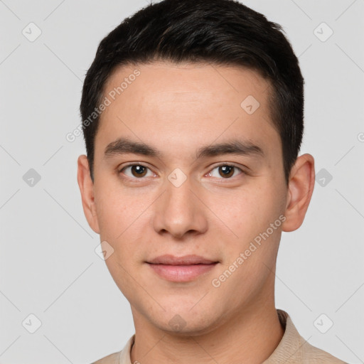 Joyful white young-adult male with short  black hair and brown eyes