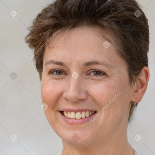 Joyful white adult female with short  brown hair and brown eyes