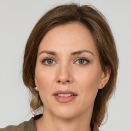 Joyful white young-adult female with medium  brown hair and green eyes